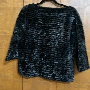 Faux fur black sweater. Looks great with black leather pants or jeans!